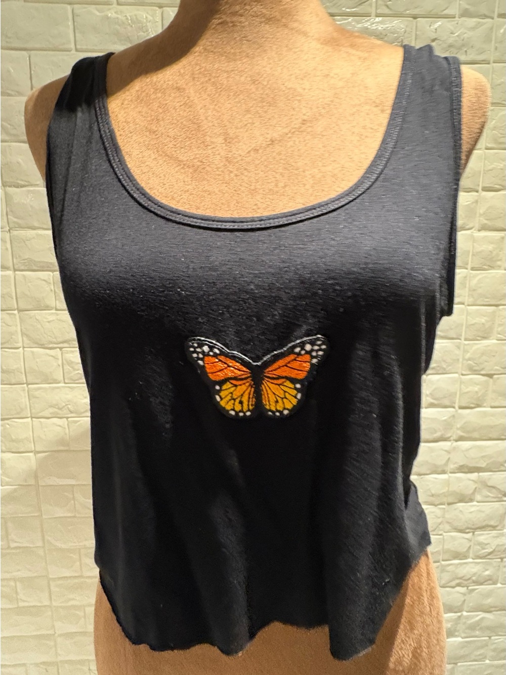 Sleeveless Black Tank Top with Orange Butterfly Embroidered Accent